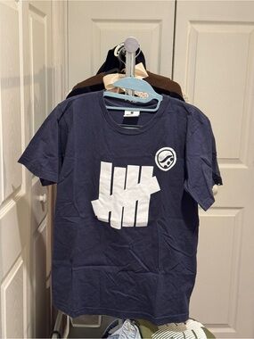 Undefeated Navy Blue Short Sleeve Tee with White Logo